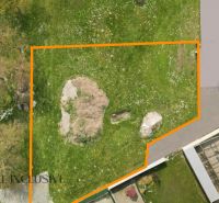A plot for residential use in Rohovce surrounded by green grass and trees.