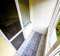 Glazed balcony with tiles in a 3-room apartment.