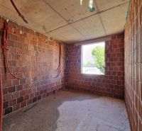 Interior construction with brick walls in a 3-room apartment.