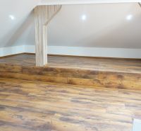 Attic room in a 4-room apartment with a wooden decor floor.