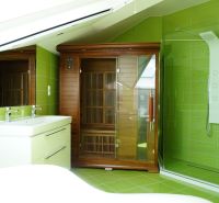 Green and white bathroom with a sauna in a 4-room apartment.