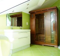 A bathroom in a 4-room apartment with a sauna and green tiles.