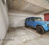 Garage parking with a blue SUV in a 2-room apartment on Zuzany Chalupovej in Bratislava - Petržalka.
