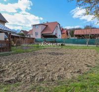 A family house in Považská Bystrica with a landscaped garden and a fenced plot.