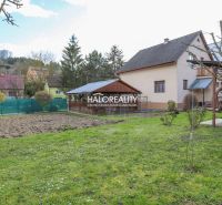 A family house in Považská Bystrica with a spacious garden and a gazebo on the grassy area.