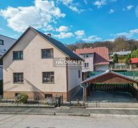 A family house in Považská Bystrica with a spacious plot and a carport.