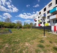 A playground in front of a colorful apartment building on Hornostavska Street in Nitra.