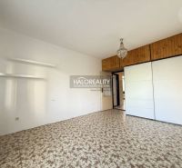 A hallway in a 3-room apartment with a built-in wardrobe and a patterned carpet.