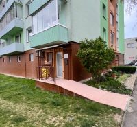 Apartment building on Robotnícka Street in Senica with surrounding greenery and a ramp.