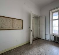 Interior with an old map on the wall, the space belongs to peculiar properties.