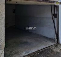 A garage in Dunajská Streda with a concrete floor and open doors.