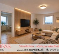 Living room in a two-room apartment with a wooden decor floor and a comfortable sofa.