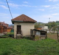 A family house in the village of Horná Súča with a small extension and a garden.
