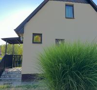 A family house with a garden in Chotín on Pri stanici street, surrounded by greenery.