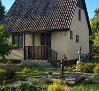 A family house with an old roof and a garden on Pri stanici Street in Chotín.