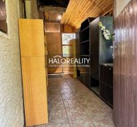 A narrow hallway with built-in wardrobes in the Gardens provides storage space.