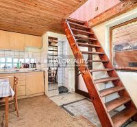 Rustic kitchen with stairs and wooden ceiling in Záhrady near Nové Zámky.