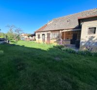 A family house in Tvrdošovce with a large garden and flower beds.