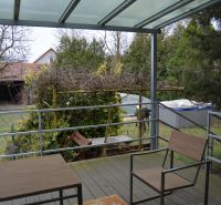The terrace of a family house on Húšky in Borský Svätý Jur with a view of the garden.