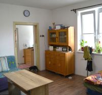 Living room of a family house with furniture and flooring with a wood decor.