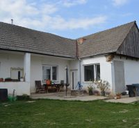 A family house in Nižná with a lawn, terrace, and garden furniture.