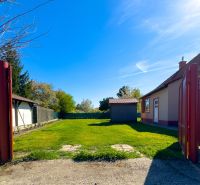 A family house in Orechová Potôň with a yard, a hedge, and a shed.
