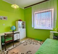 Children's room in a family house with colorful walls and a desk.