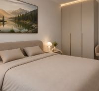 Bedroom with a double bed in a family house. Modern lighting and stylish furniture.