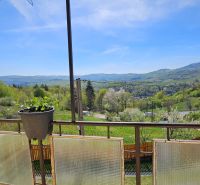 The view from the family house in Štiavnické Bane of the picturesque landscape and green hills.