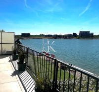 View from the terrace of a family house in Boldog to the lake and nearby plots.