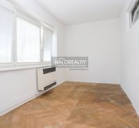 A bright room in a 3-room apartment with a wood-patterned floor, white walls.