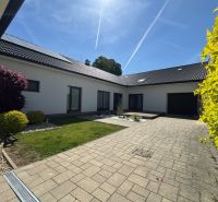 Family house on Petőfi Street in Šahy with a landscaped yard and paving.