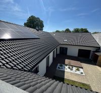 The family house on Petőfi Street in Šahy has solar panels and a paved yard.