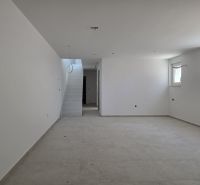 A spacious room in a 3-room apartment with simple stairs and two windows.