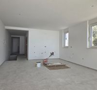 A spacious room in a 3-room apartment with large windows and a light floor.