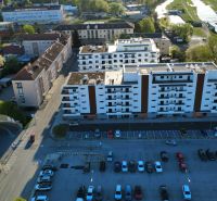 Aerial view of residential buildings and a parking lot in the city of Zvolen.