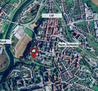 Aerial view of Stará Ľubovňa, 17. novembra Street, highlighted supermarkets and Štefánik Square.
