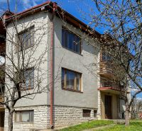 A family house on 17. novembra Street in Stará Ľubovňa surrounded by trees and lawn.