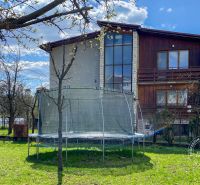 A family house on 17. novembra Street in Stará Ľubovňa with a trampoline in the garden.