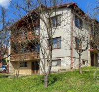 A family house on 17. novembra Street in Stará Ľubovňa surrounded by greenery and trees.