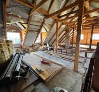 The attic of a family house in Vislanka, ongoing renovation, visible construction materials.