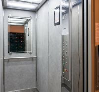 The interior of an elevator with a large mirror in a 3-room apartment.