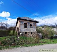 An old house with a decorated facade in the village of Heľpa, Unique properties on the hill.