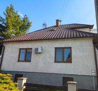 A family house in Zlaté Moravce with a sloped roof and a well-maintained garden.