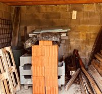Warehouse with bricks, pallets, and construction materials at the Cottage in Nova Kelca, Recreational Area.