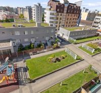 Playground and green areas near the apartment building on Majerníkova Street, Karlova Ves.