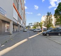 A view of Majerníkova Street in Bratislava - Karlova Ves with parking spaces.