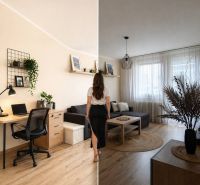 Living room in a 3-room apartment with a wooden decor floor and a work corner.