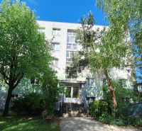 An apartment building surrounded by trees on Vrbovská Street in Piešťany.