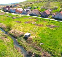 A view of green lands in Hodejov, ideal for living near a small stream.